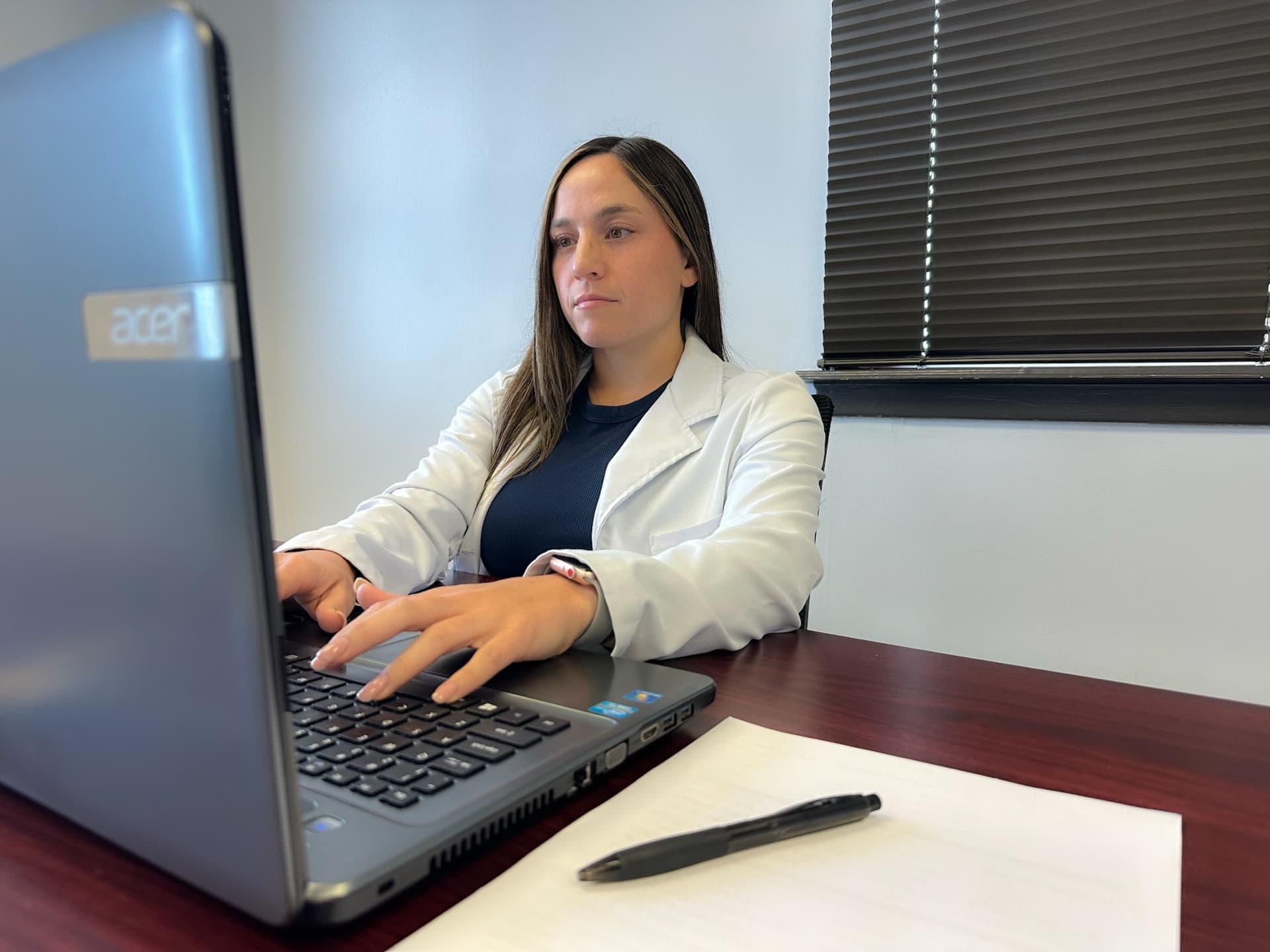 Aspire Health & Wellness provider reviewing a patient's health history in Metairie