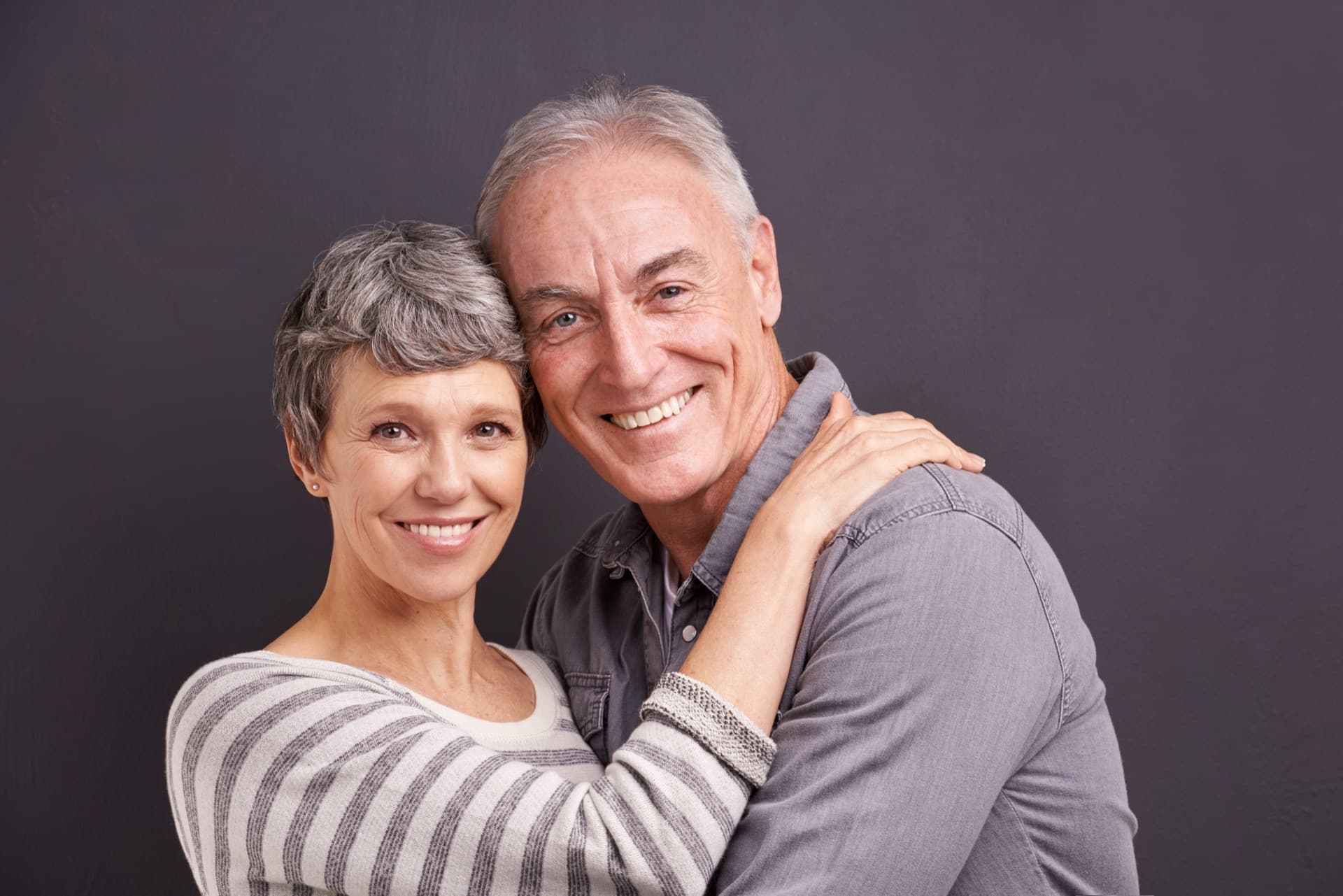 Couple embracing at home