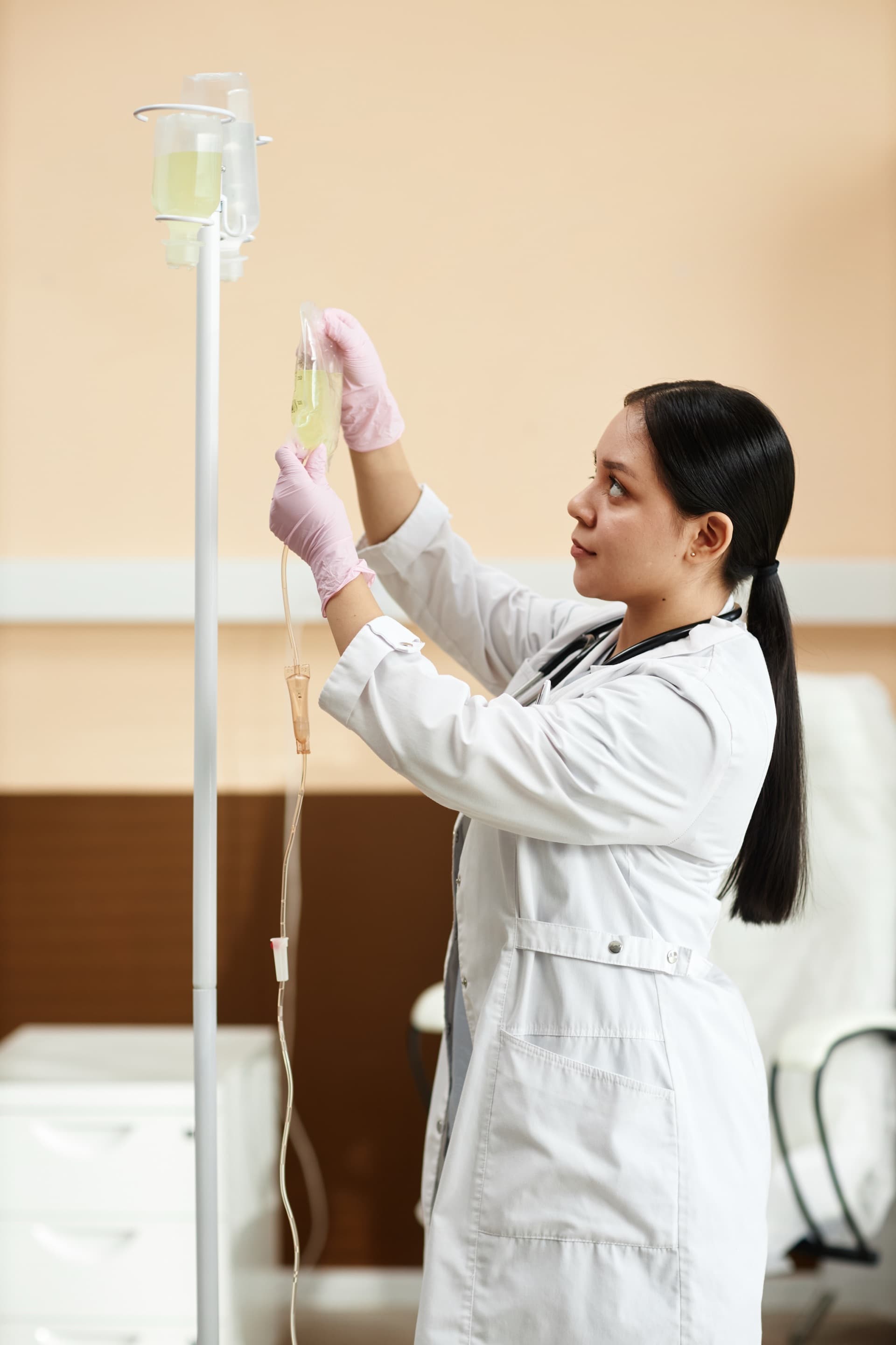 Clinician preparing an IV bag at Aspire Health & Wellness