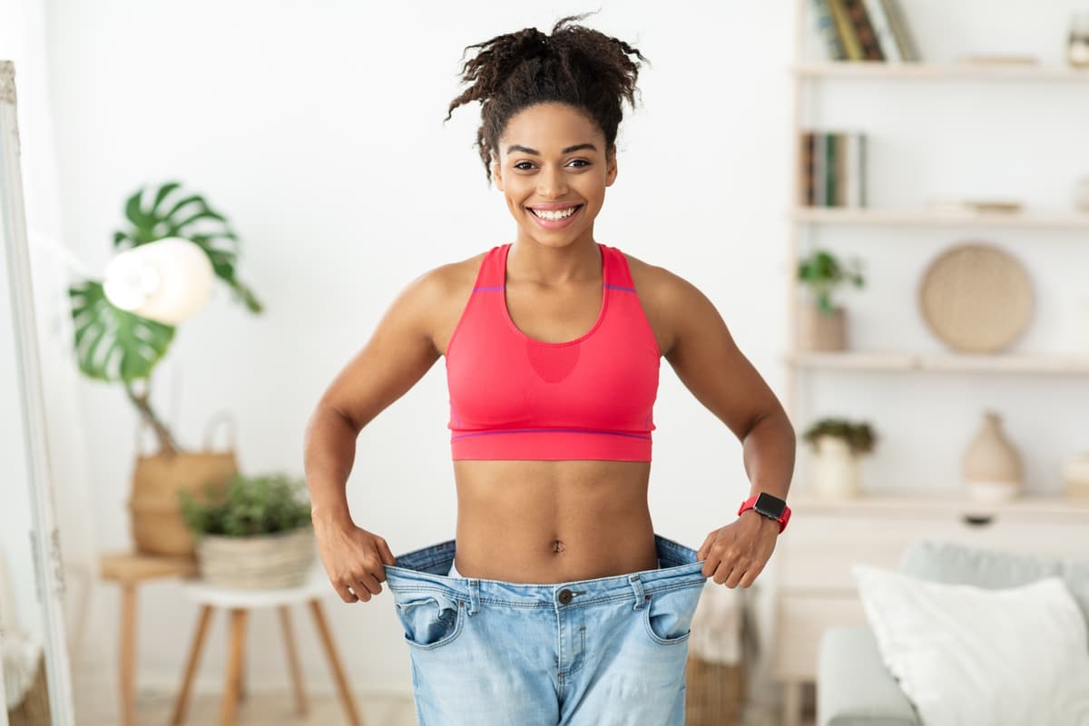 Woman celebrating weight loss success at Aspire Health