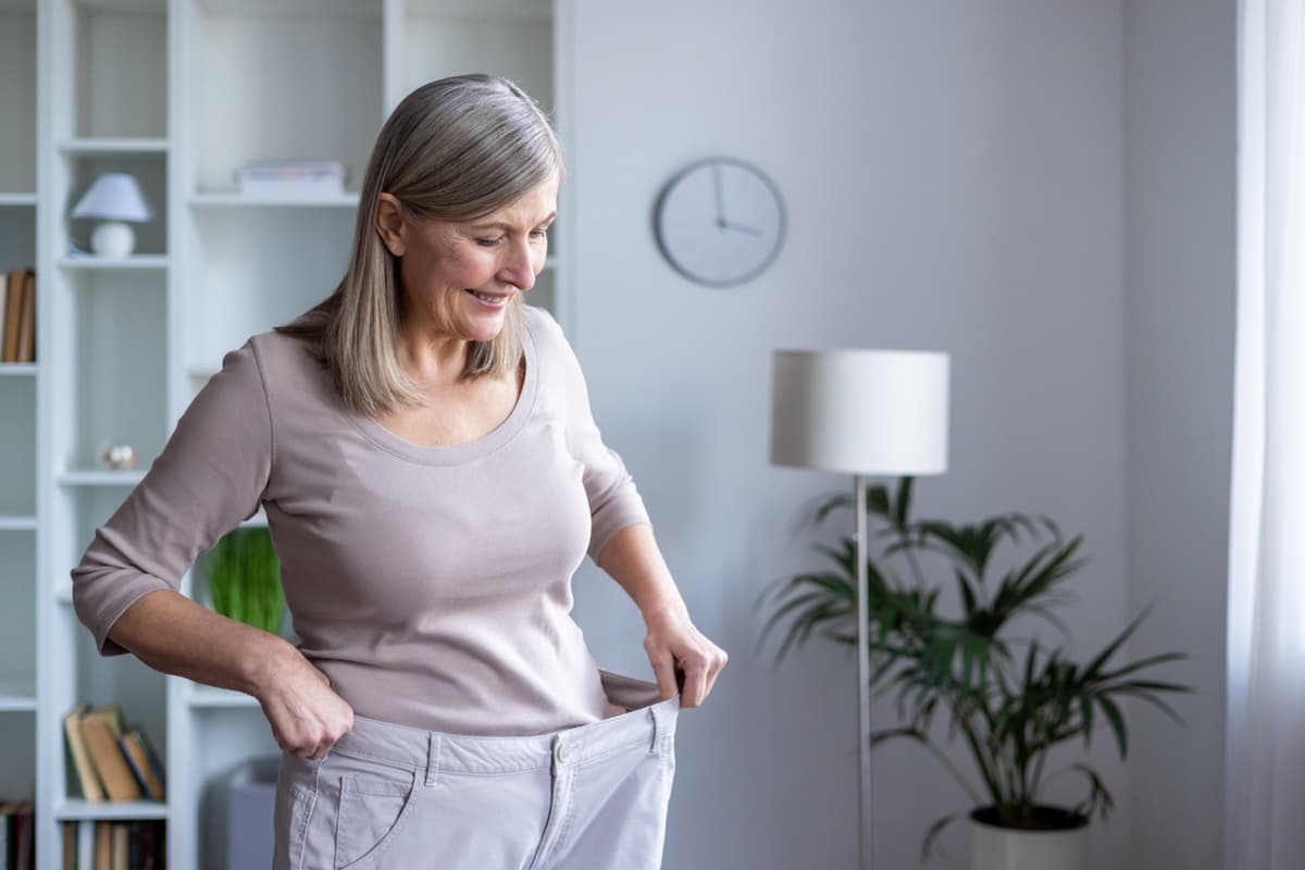 Patient celebrating medical weight loss success at Aspire Health